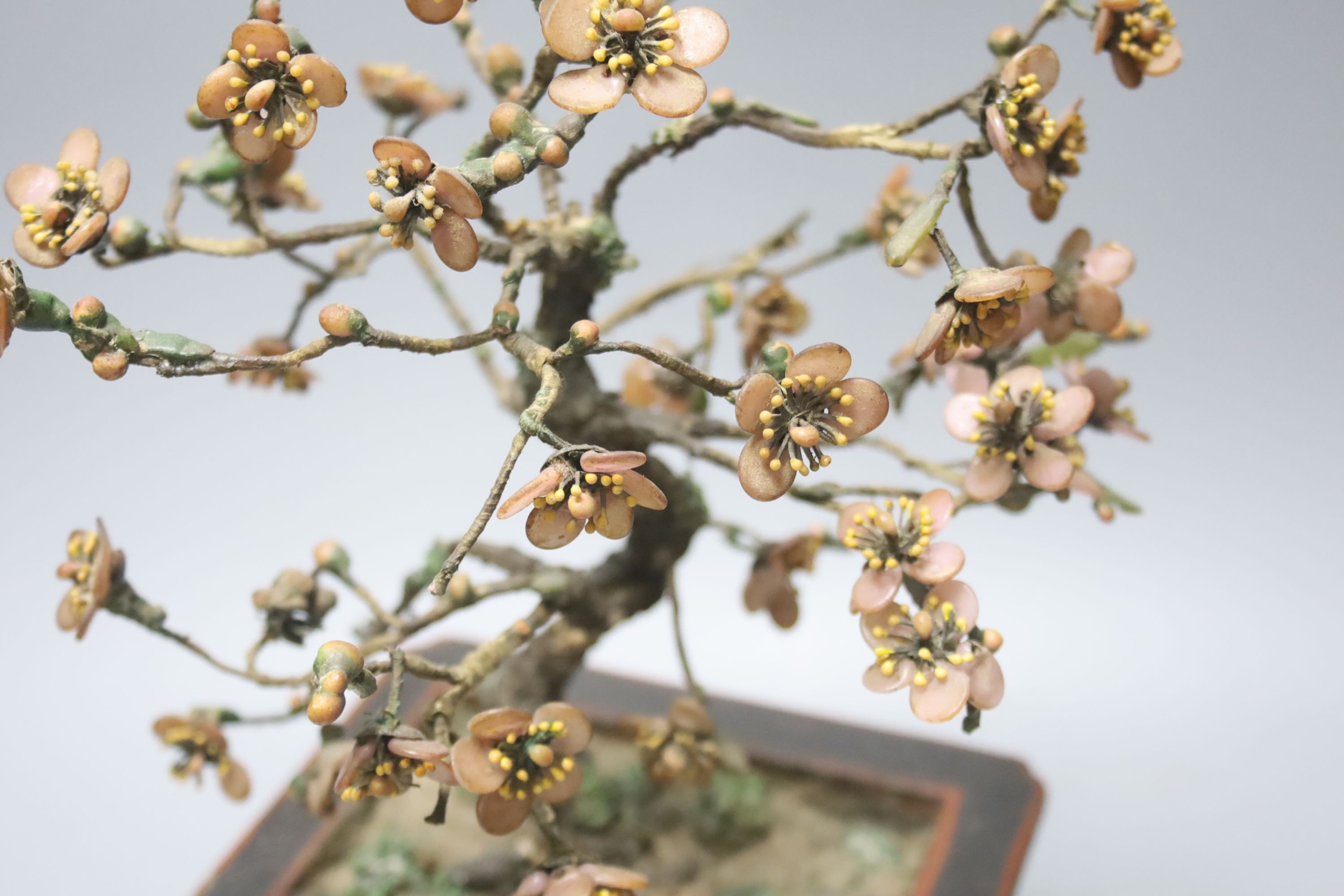 An early 20th century Chinese coloured glass and lacquer model of a tree in a jardiniere 35cm